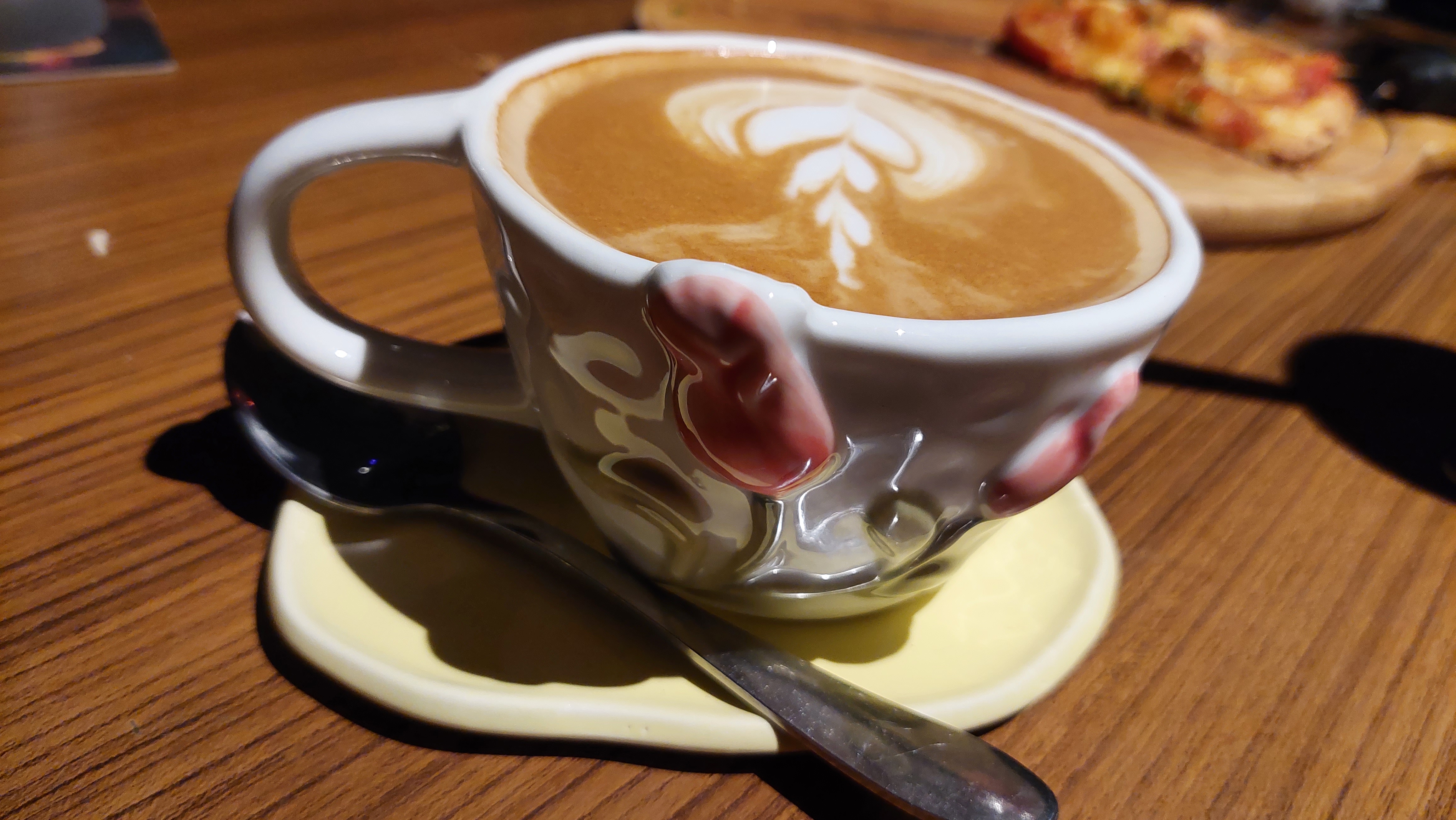 Four cups of latte with foam art