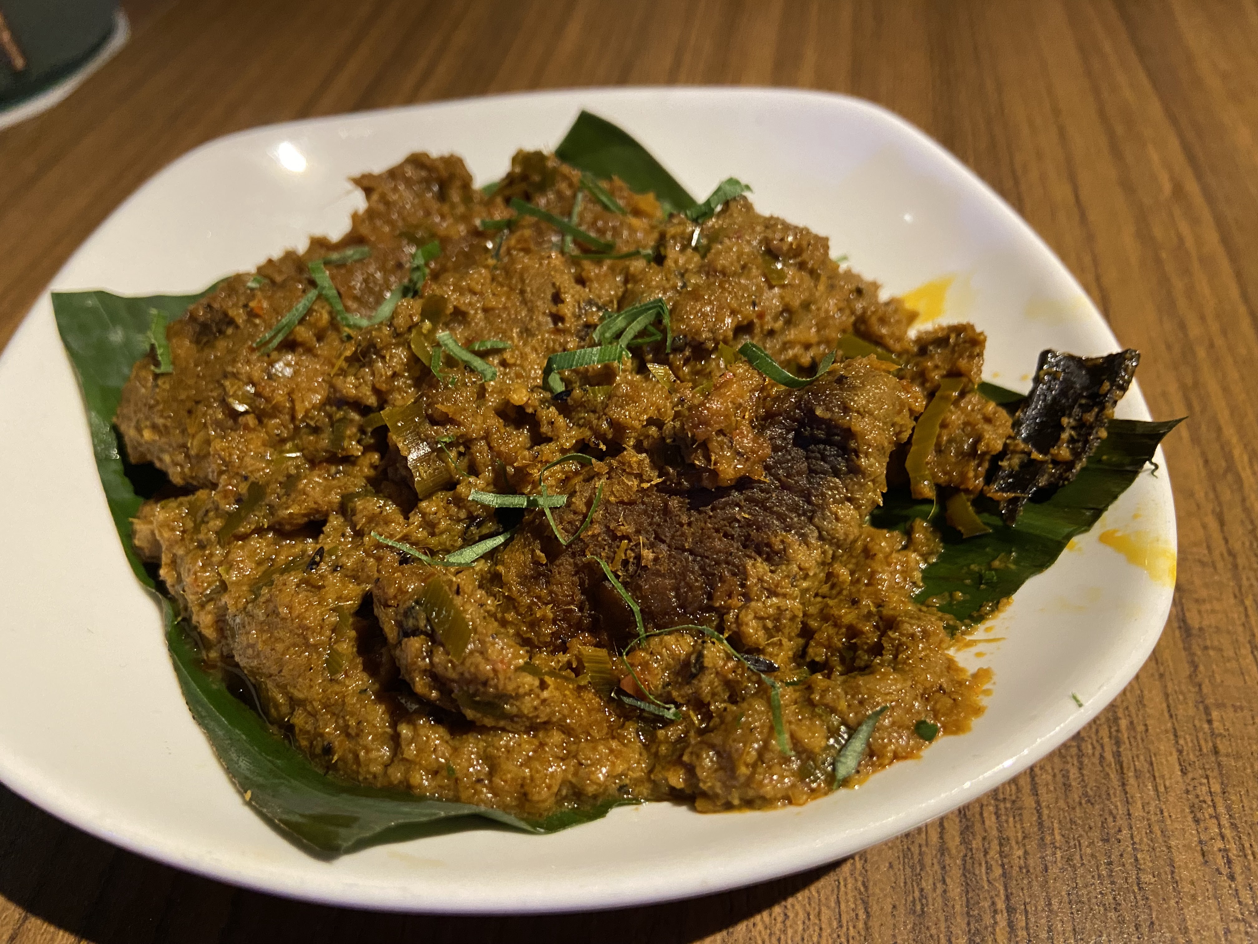 Rendang Daging on a banana-leaf-lined plate